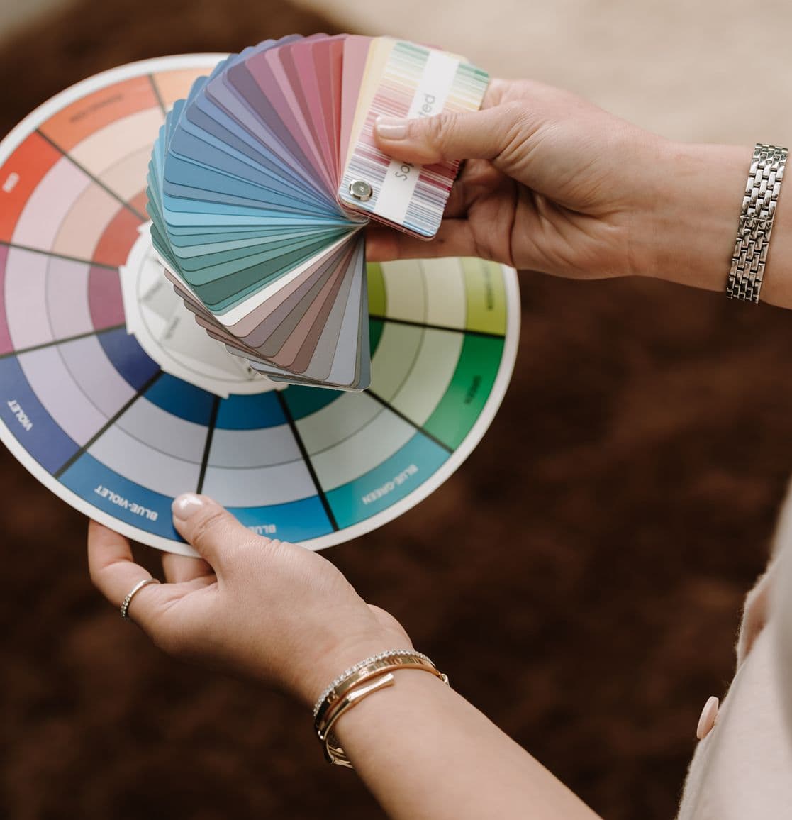 A fanned deck of colour swatches spread across a table